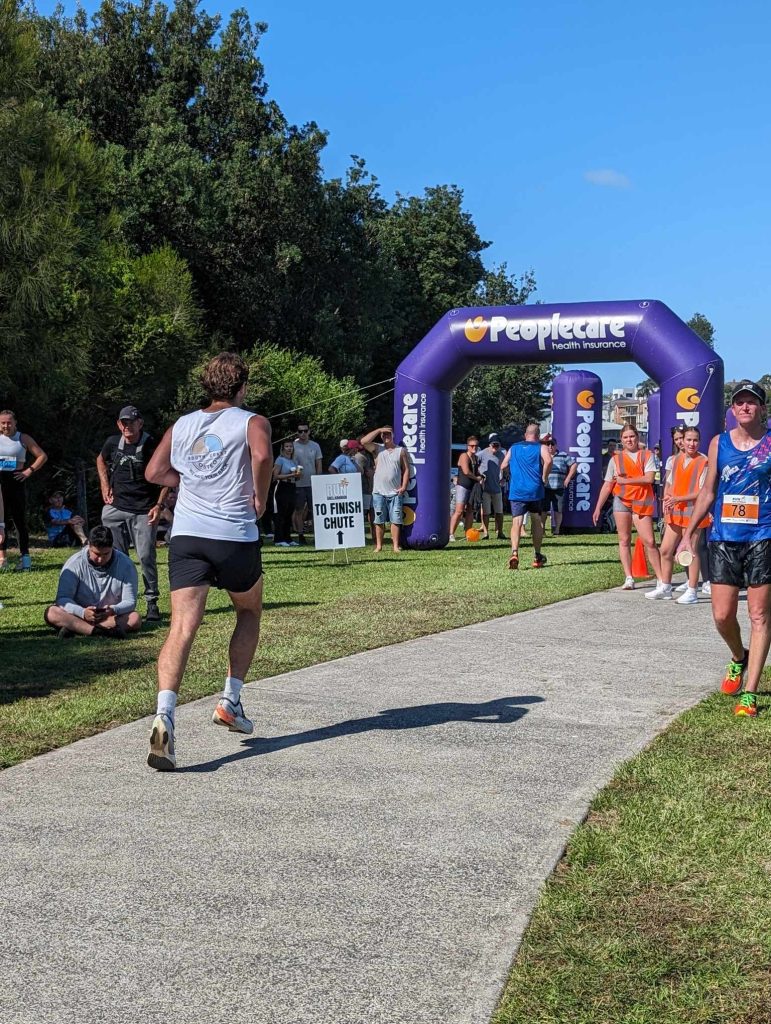 Osteopath Running toward finish line of race